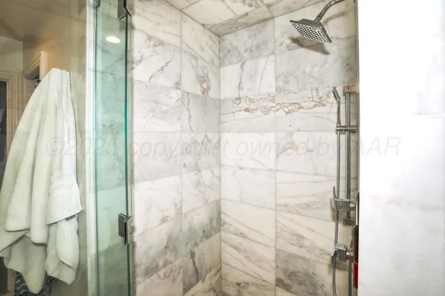 a bedroom with furniture and a wooden floor