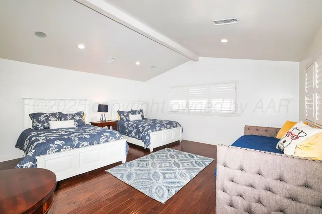 a bathroom with a shower sink and mirror