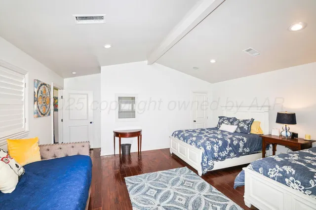 a bathroom with a sink toilet vanity and shower