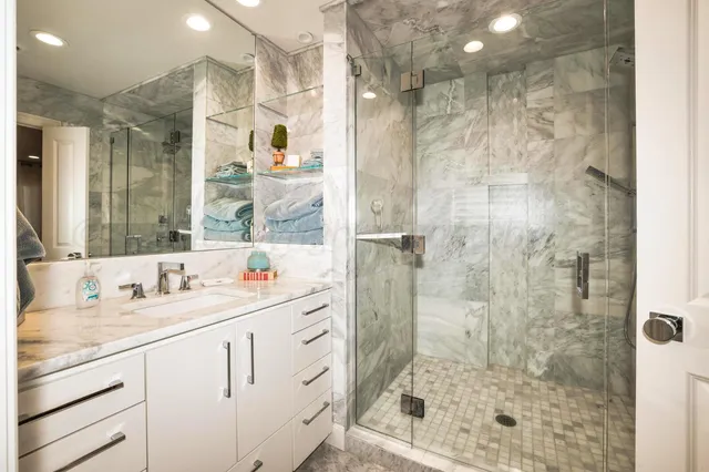 a view of a chairs and table in patio with a yard