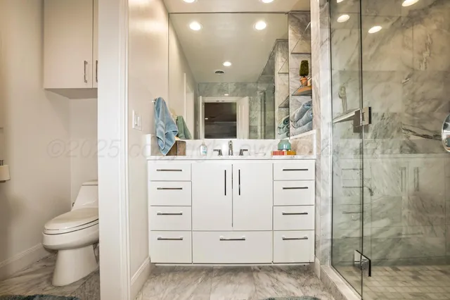 an aerial view of residential houses with yard