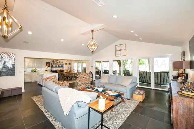 a living room with fireplace furniture and a flat screen tv