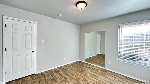 a view of an empty room and window