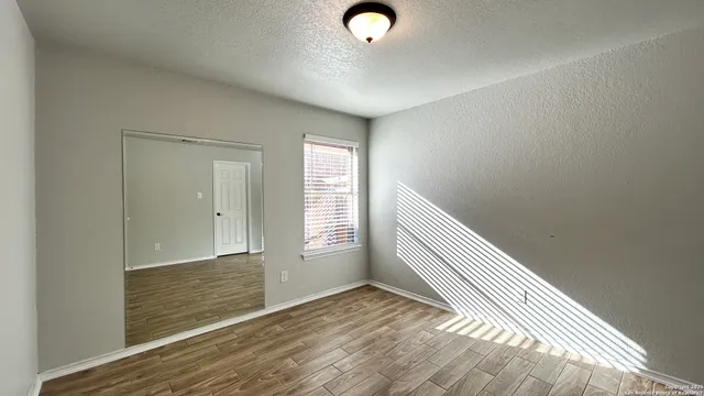 a view of an empty room and window