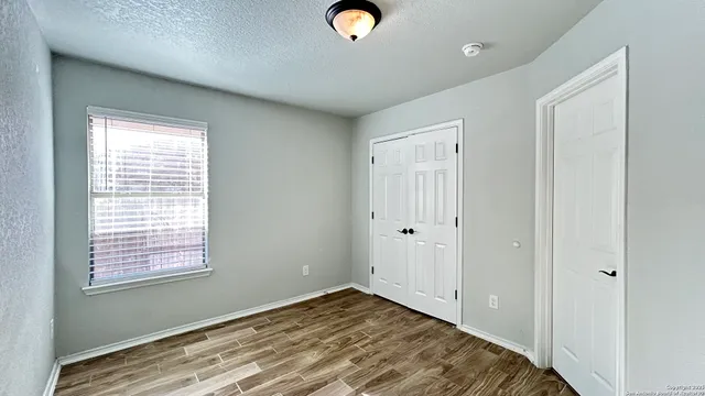 a view of a livingroom with wooden floor