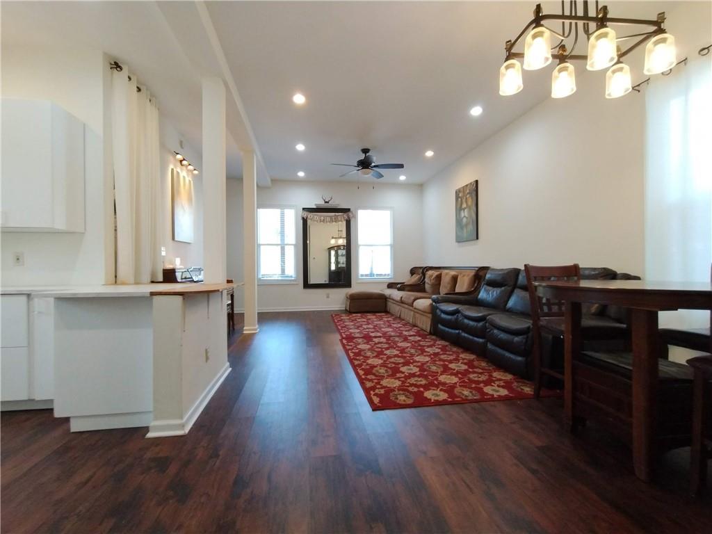 125 Strippling Street Ball Ground, GA 30107 - Photo 12 of 35 a living room with furniture and a wooden floor