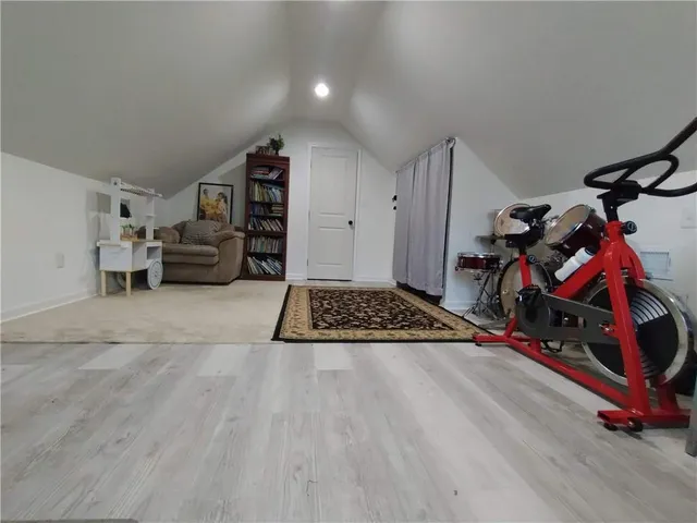 a bedroom with furniture and a gym equipment