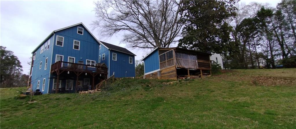 125 Strippling Street Ball Ground, GA 30107 - Photo 2 of 35 front view of house with a yard