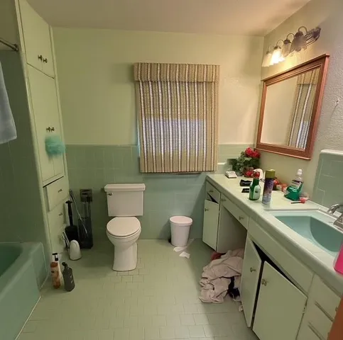 a view of house with a yard