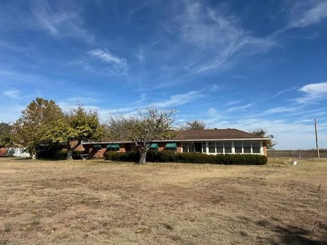 a kitchen with refrigerator and cabinets