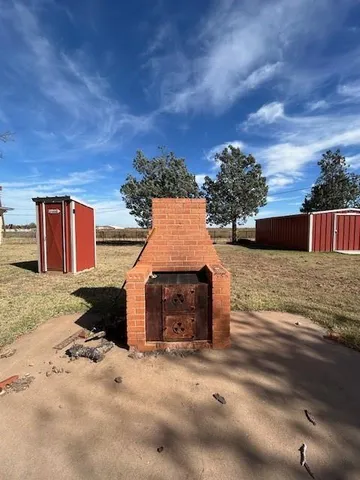 a view of a car park in front of house