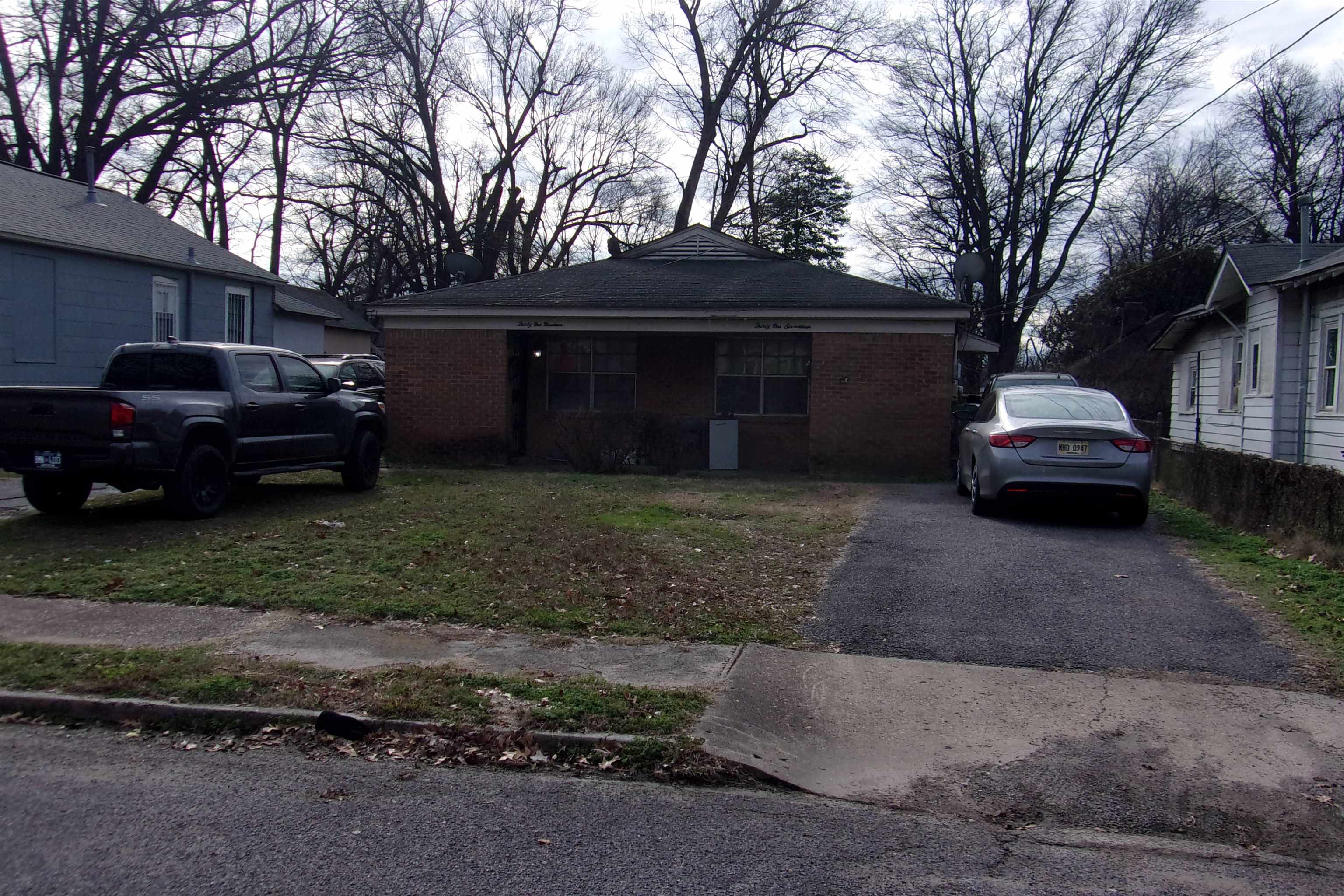 3117 Pacific Avenue Memphis, TN 38112 - Photo 4 of 4 a car parked in front of a house