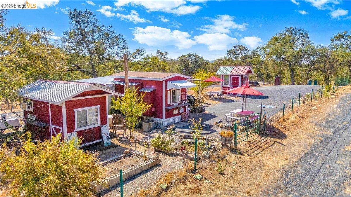 14450 Jacksonville Road Jamestown, CA 95327 - Photo 60 of 85 Multiple red structures with metal roofs