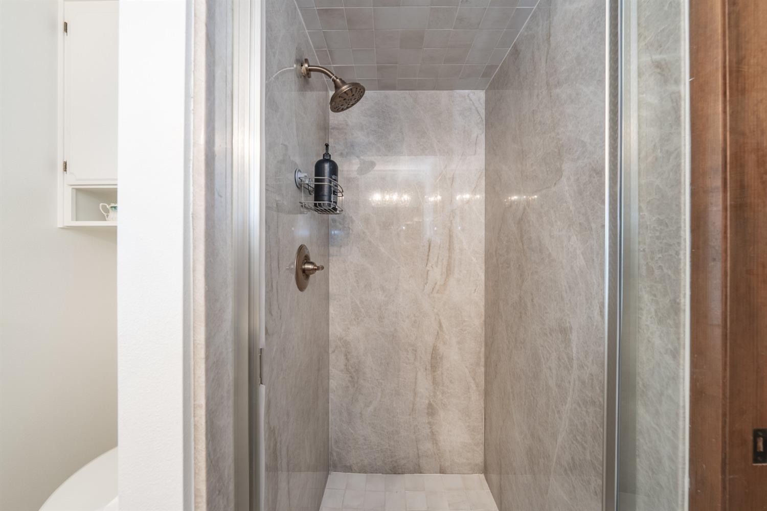 2370 Jonathan Way Madera, CA 93637 - Photo 22 of 41 a bathroom with a shower