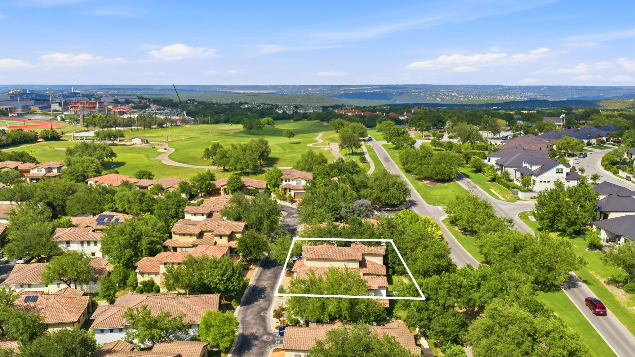 15317 Falconhead Grove Loop Austin, TX 78738 - Photo 7 of 36 Aerial perspective showcasing the property within a residential community featuring mature trees and a golf course