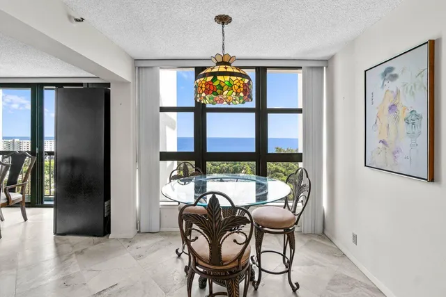 a kitchen with granite countertop a sink stove and cabinets