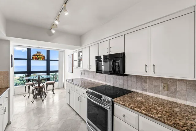a bathroom with a toilet sink and shower