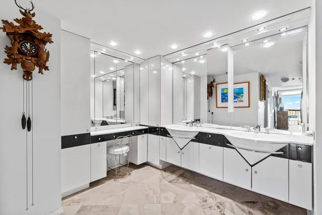 an aerial view of a house with a garden and lake view