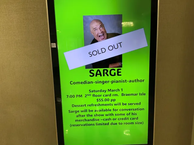 a view of a tennis ground with large trees