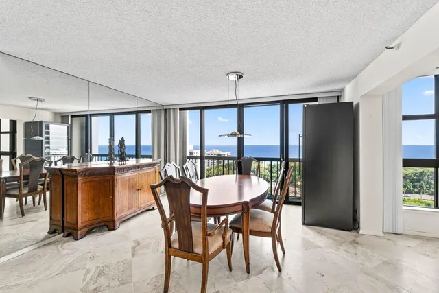 a kitchen with stainless steel appliances granite countertop a sink stove and microwave