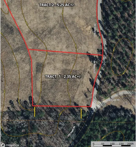 a view of a field with an ocean