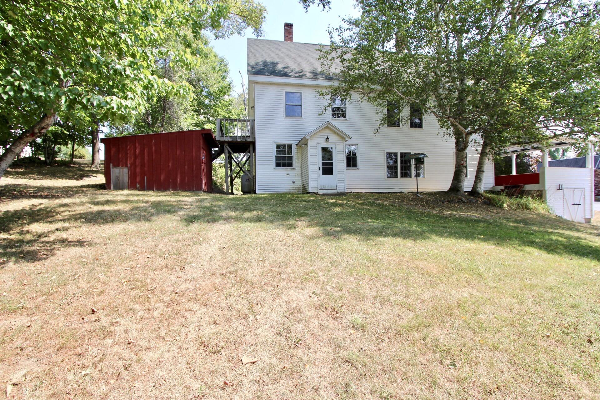 3 Stanislaus Road Lincoln, ME 04457 - Photo 5 of 51 Side view from the yard