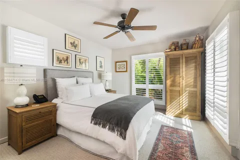 a view of a house with backyard sitting area and garden