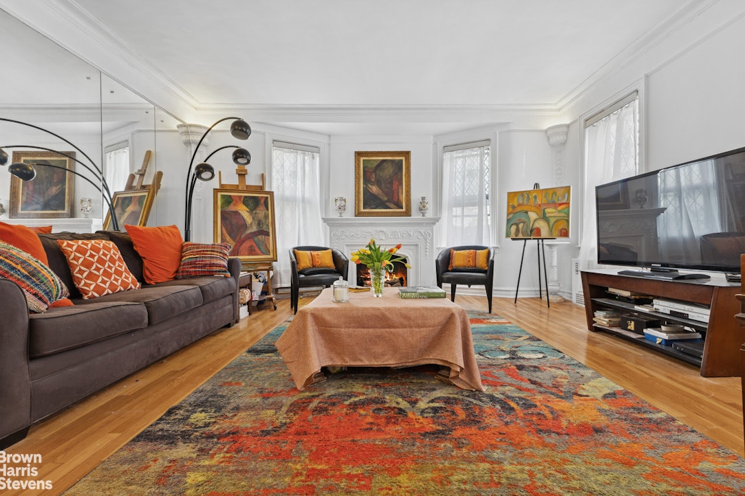 1702 East 28th Street Brooklyn, NY 11229 - Photo 2 of 17 a living room with furniture and a flat screen tv