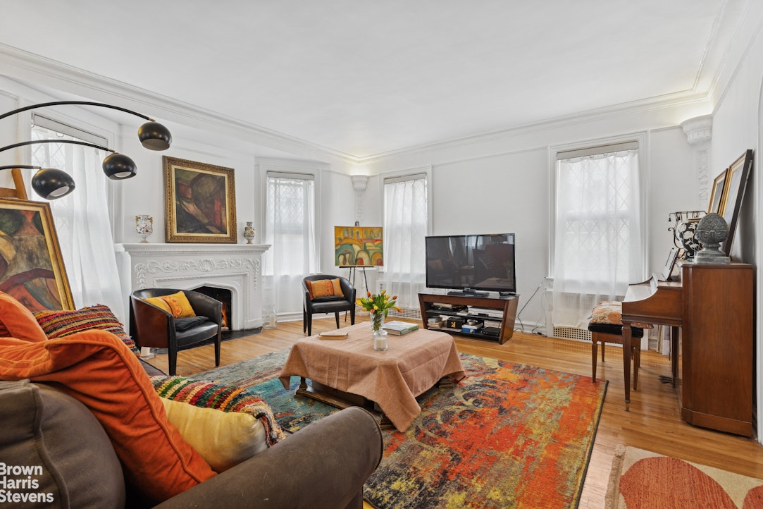 1702 East 28th Street Brooklyn, NY 11229 - Photo 7 of 17 a living room with furniture and a flat screen tv