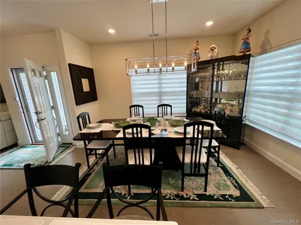 a kitchen with stainless steel appliances granite countertop a sink and a stove