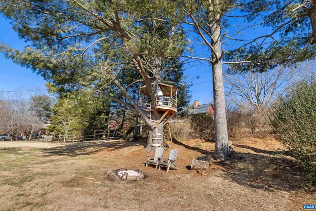 a view of entryway with wooden floor and window