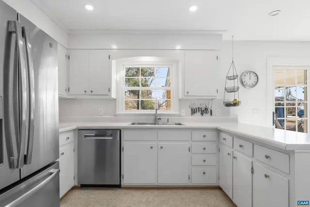 a bath tub sitting in a bathroom next to a window