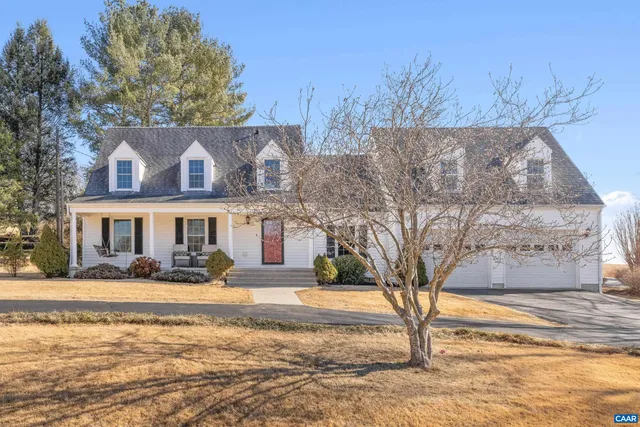 a view of a patio with a dining table and chairs