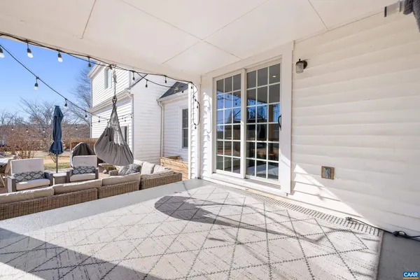 a view of a patio with couches table and chairs