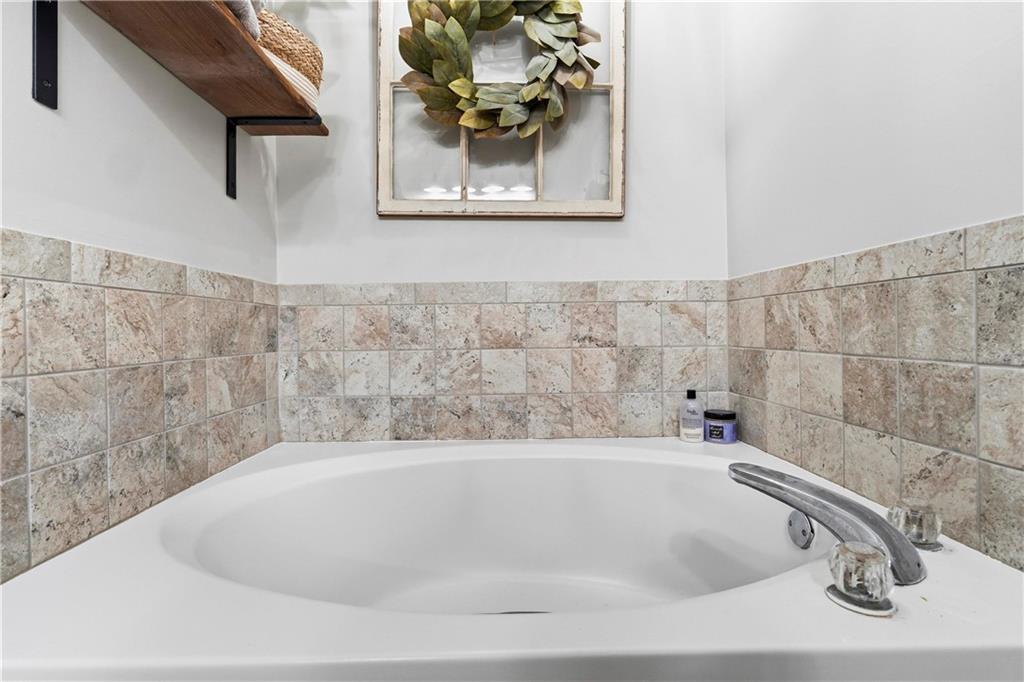 2777 Chickadee Drive Monroe, GA 30655 - Photo 15 of 36 a bathroom with a bathtub