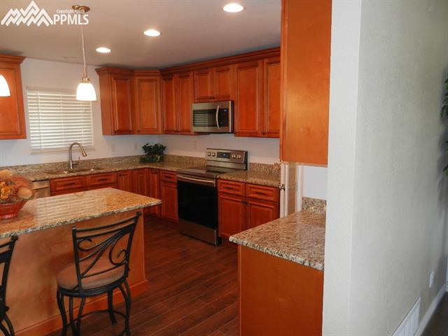 16555 Bar X Road Colorado Springs, CO 80908 - Photo 13 of 36 The kitchen even has a new sink and faucet to go along with the upgraded stainless appliance package.