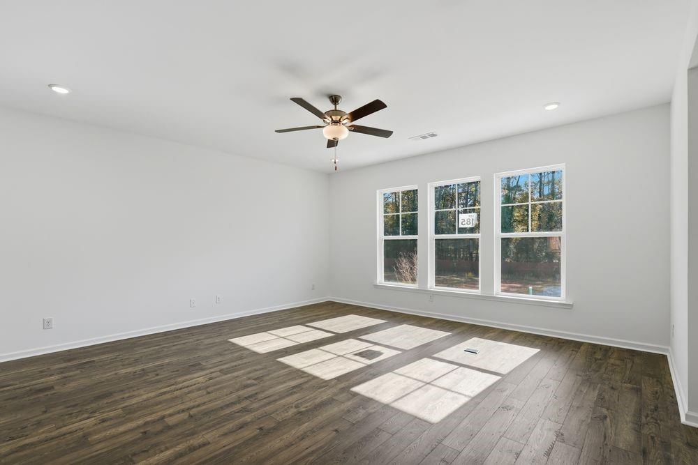 6121 Wayburn Street Tucker, GA 30084 - Photo 11 of 47 a view of an empty room with a window and wooden floor