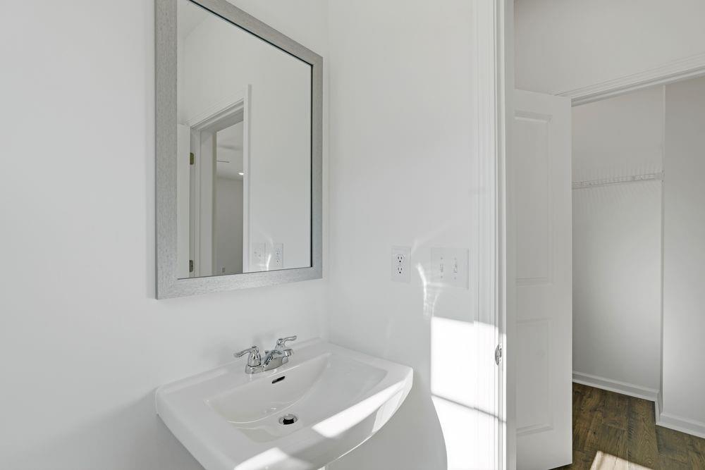 6121 Wayburn Street Tucker, GA 30084 - Photo 16 of 47 a bathroom with a sink and a mirror