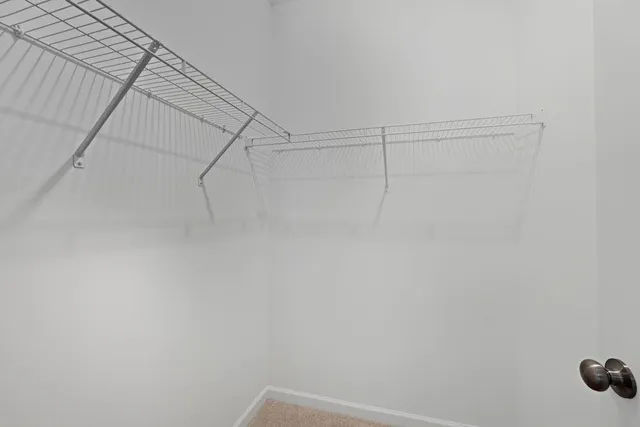 a view of a room with racks on the wall