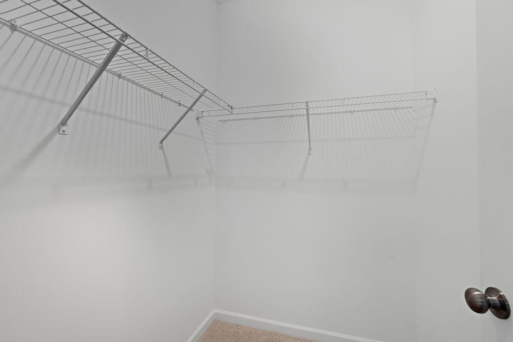 6121 Wayburn Street Tucker, GA 30084 - Photo 25 of 47 a view of a room with racks on the wall