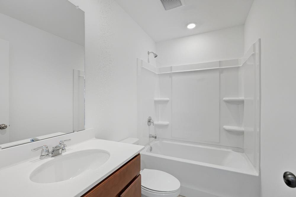 6121 Wayburn Street Tucker, GA 30084 - Photo 30 of 47 a bathroom with a sink toilet and shower