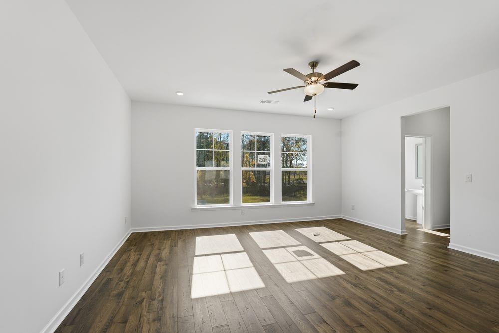 6121 Wayburn Street Tucker, GA 30084 - Photo 10 of 47 an empty room with wooden floor and windows