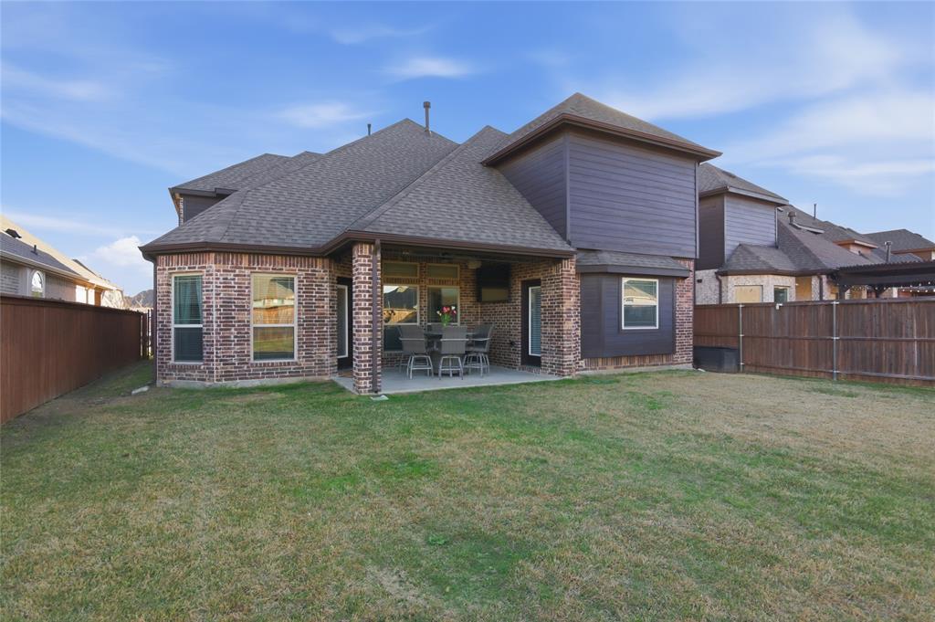 464 LeTara Ranch Drive Haslet, TX 76052 - Photo 32 of 37 Brick and siding exterior featuring a covered patio with a concrete surface