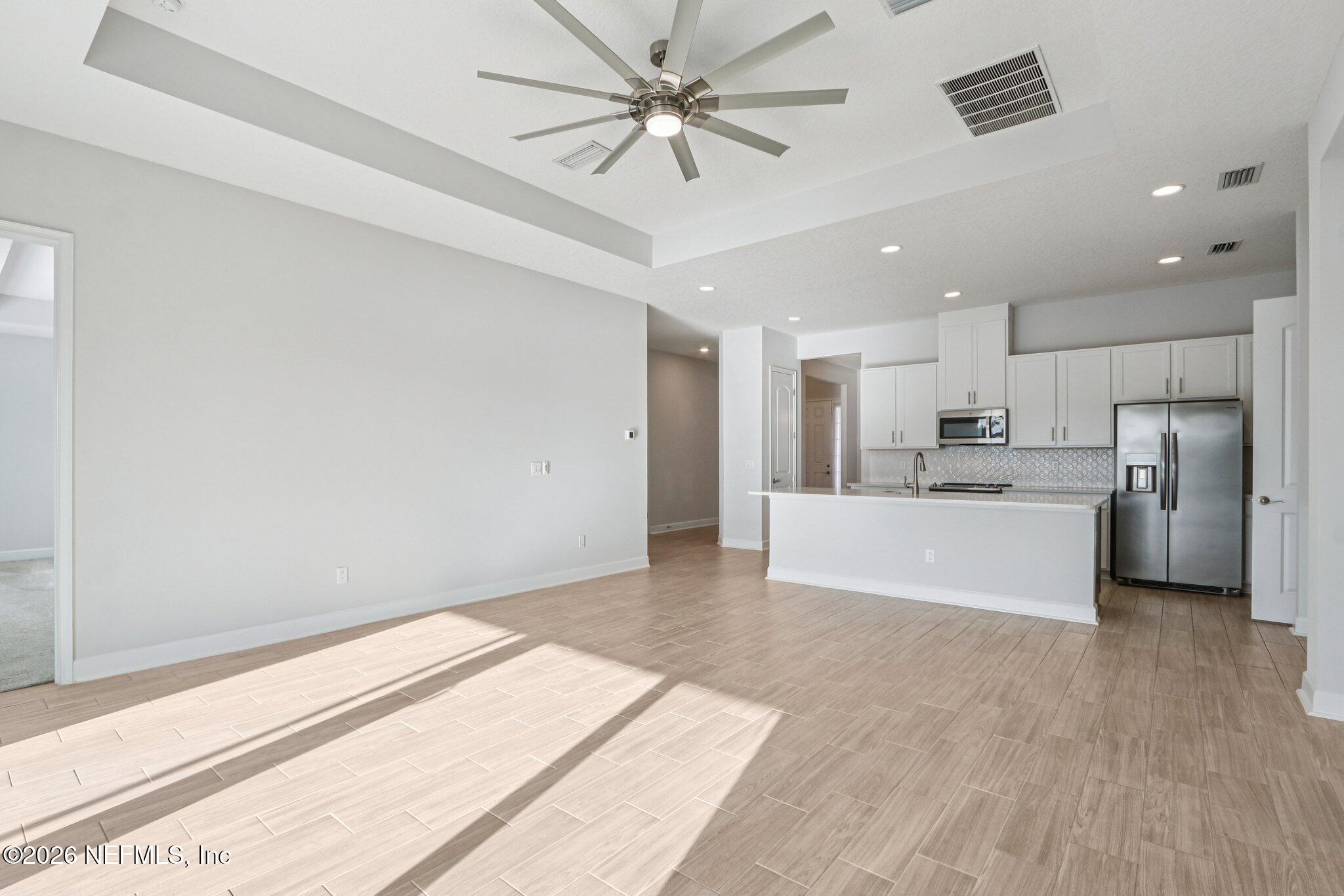 1724 Austin Lk Way Middleburg, FL 32068 - Photo 18 of 61 a view of kitchen with stainless steel appliances refrigerator oven and cabinets