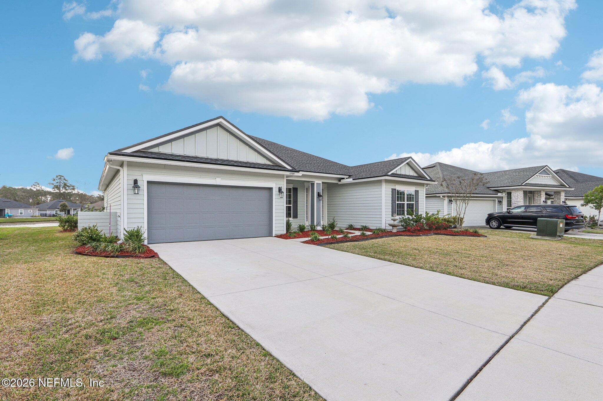 1724 Austin Lk Way Middleburg, FL 32068 - Photo 3 of 61 a front view of a house with yard and tress