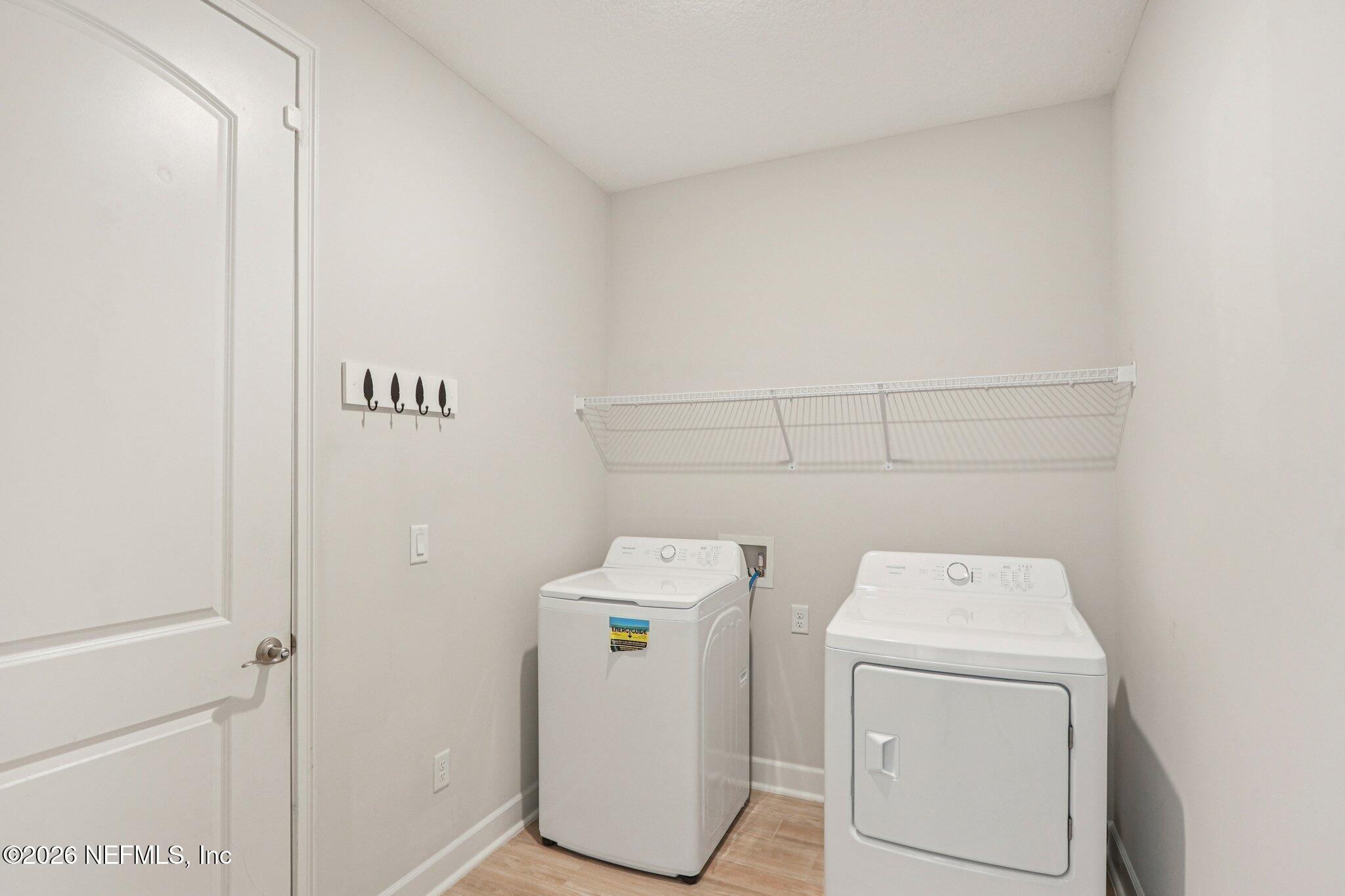 1724 Austin Lk Way Middleburg, FL 32068 - Photo 33 of 61 a utility room with dryer and washer