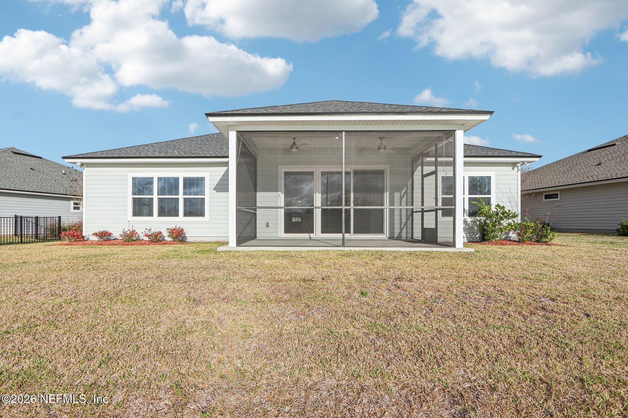 1724 Austin Lk Way Middleburg, FL 32068 - Photo 37 of 61 front view of a house with a large window and table