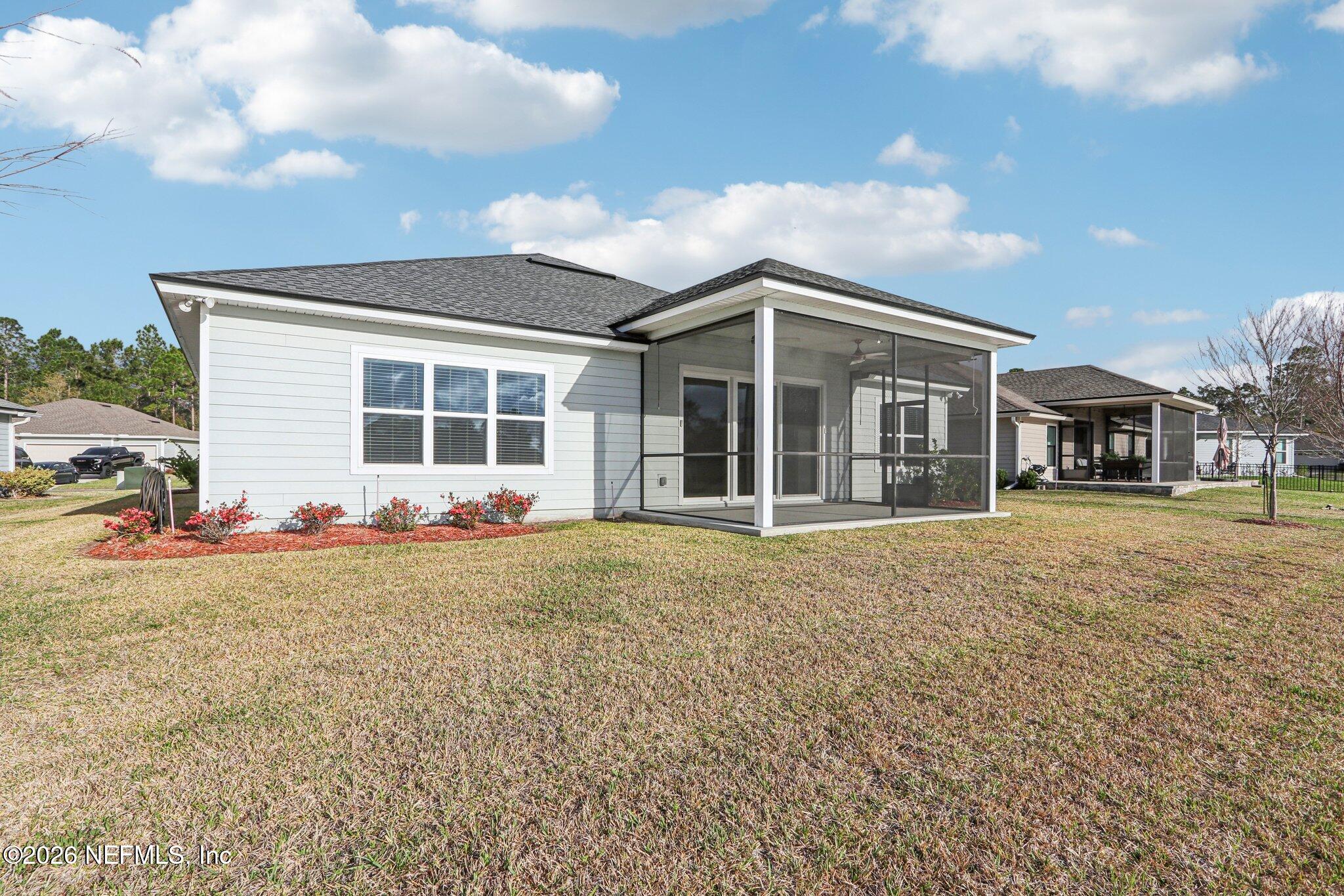 1724 Austin Lk Way Middleburg, FL 32068 - Photo 38 of 61 a view of a house with a yard and garage