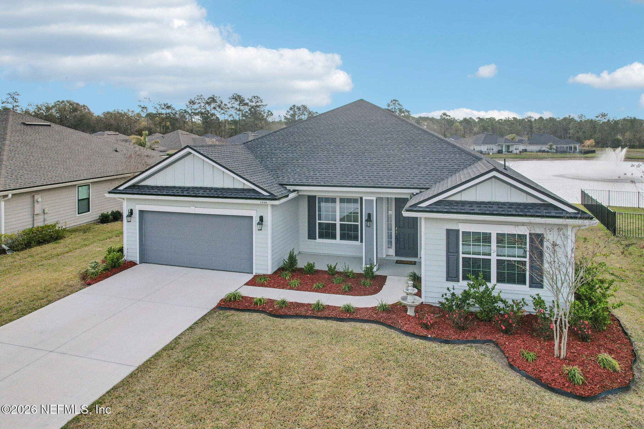 1724 Austin Lk Way Middleburg, FL 32068 - Photo 42 of 61 front view of a house with a yard