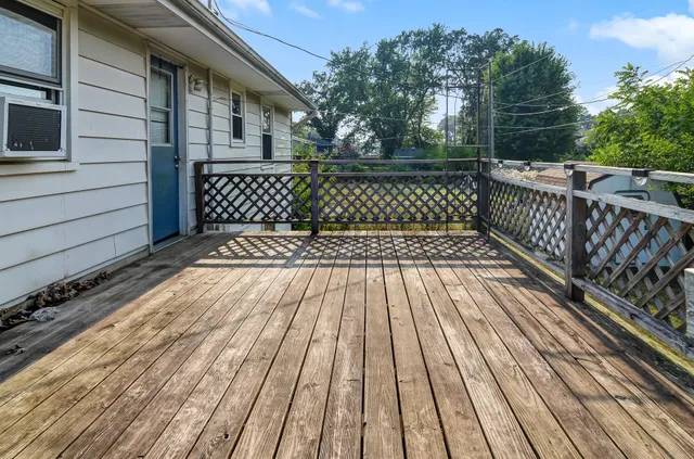 a view of outdoor space with wooden floor
